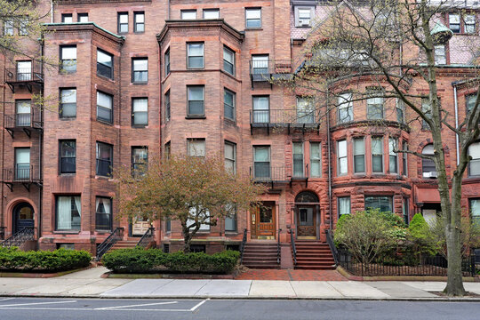 Old brownstone apartment buildings with bay windows