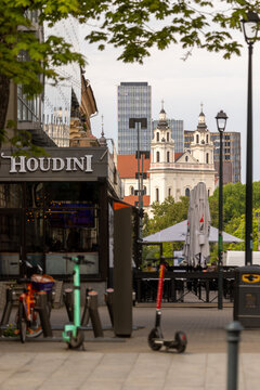 Street view towards Church of St Raphael and skyscrapers in Vilnius Lithuania