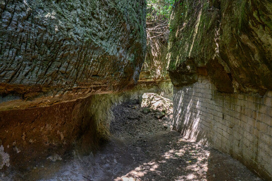 Deep carved walls of the Etruscan Via Cava di San Rocco sunken road, Sorano, Italy