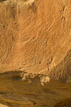 Canada, Alberta, Milk River.  Writing on Stone Provincial Park.  Petroglyph known as V-necked Huiman with Quiver of Arrows