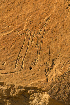 Canada, Alberta, Milk River.  Writing on Stone Provincial Park.  Petroglyph known as V-necked Huiman with Quiver of Arrows