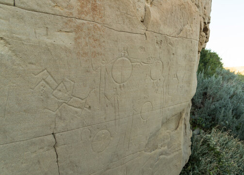 Canada, Alberta, Milk River.  Writing on Stone Provincial Park.  Petroglyph depicting shield bearing warriors