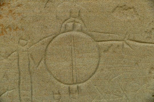 Canada, Alberta, Milk River.  Writing on Stone Provincial Park.  Petroglyph depicting shield bearing warrior