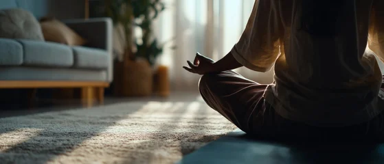 Close up of person practicing mindfulness meditation on mat at home © pixelliebe