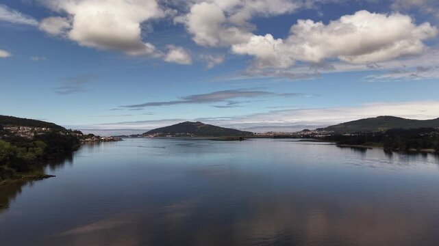 Rio mi&ntilde;o river emptying into the atlantic ocean, forming an estuary separating spain and portugal