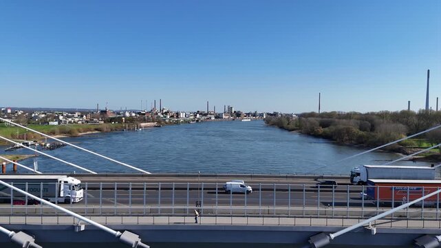 Centered bridge shot with pedestrian and traffic flow
