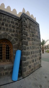Historic stone-walled Masjid al-Suqya mosque in Madinah, Saudi Arabia.