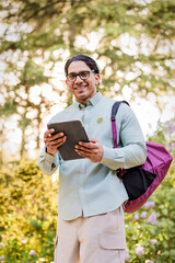 Fototapeta premium Latino man with disability studying at university campus