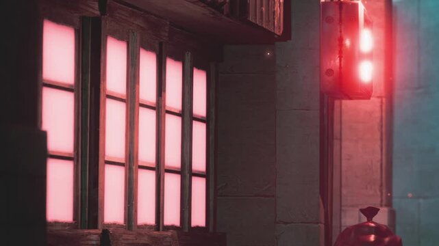 Bright pink and red lights illuminate a building wall at night. The setting shows a mix of colors with shadows creating a unique urban scene. It captures the essence of city life after dark.