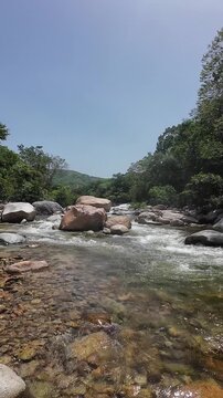 Mountain river water flowing over rocks