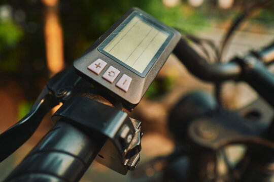 Electric bike computer glowing in warm afternoon light