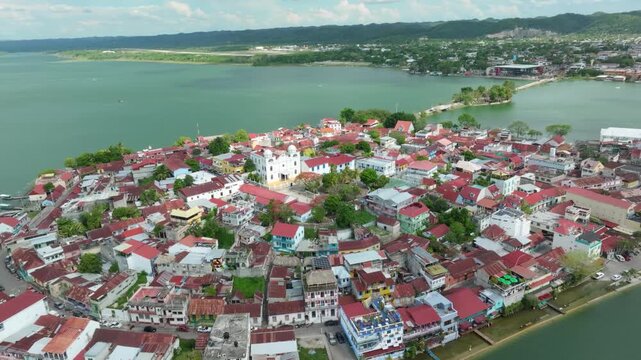 Flores island aerial view revealing lake peten itza in guatemala