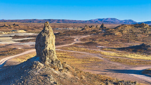 Trona Pinnacles Desert Landscape with Tufa Spires and Distant Mountains California