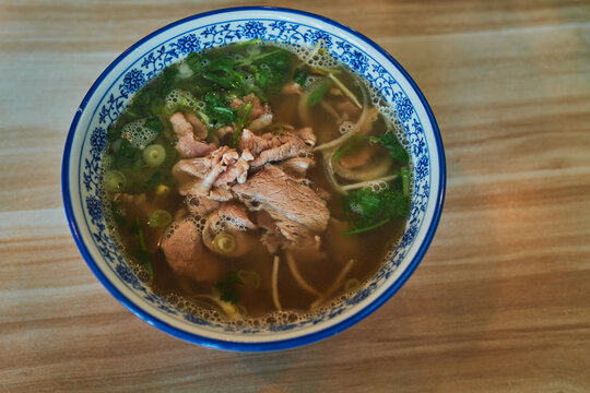 Steaming bowl of beef pho from above