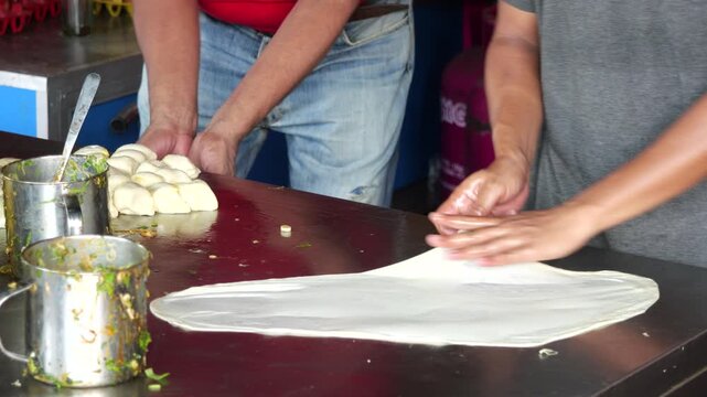 Filling Martabak Telor Pastry with Seasoned Egg and Minced Beef Mixture