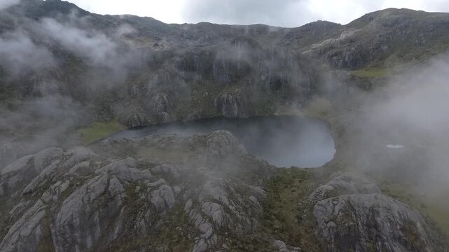 Aerial drone flight over high-altitude p&aacute;ramo lagoon, Colombian Andes