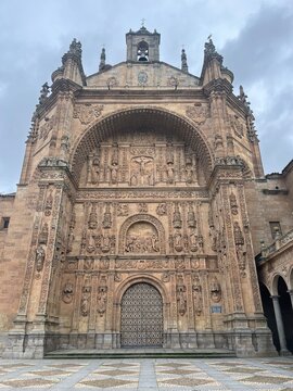 Historic Front Facade of the Convent of San Esteban (Iglesia de San Esteban) in Salamanca, Spain, Featuring Ornate Plateresque Architecture