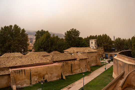 El Mechouar Palace Complex Seen from Ramparts Under a Dusty Orange Tlemcen Sky