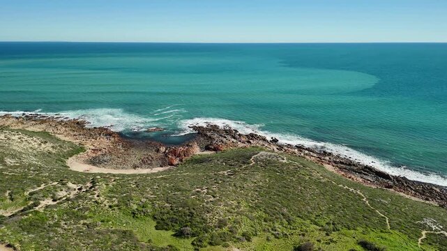 White Hut, Yorke Peninsula, South Australia &ndash; 4K aerial drone view of agricultural landscape, canola farms, contryside road, Daly Head National Surfing Reserve, rocky coastline.