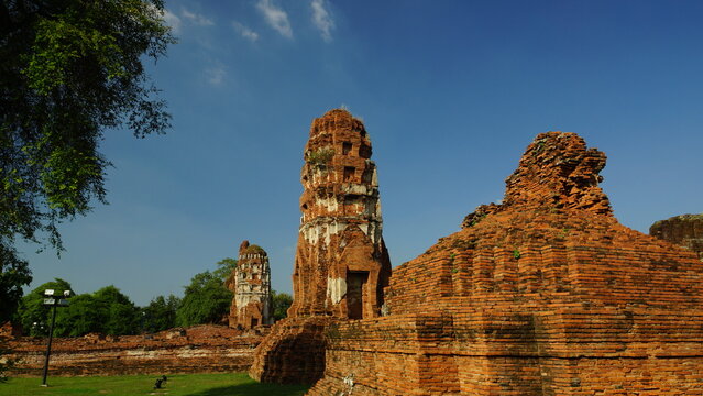 Scenic archaeological ruins in Thailand under a clear blue sky on a sunny day