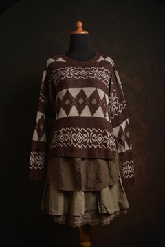 Brown Fair Isle sweater with tiered skirt outfit on display mannequin
