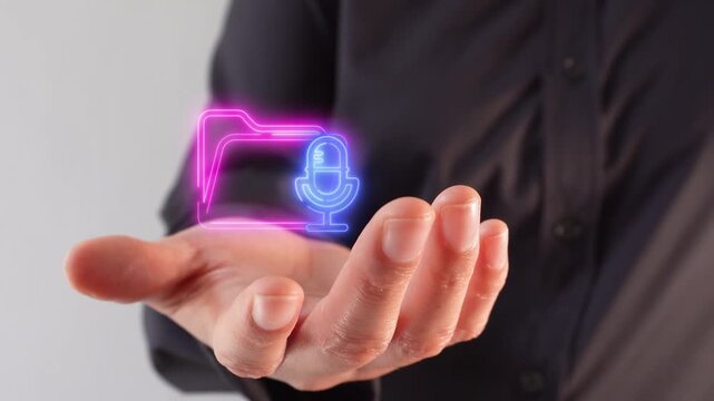 Close-up of a businesswoman's hand holding a virtual folder icon with a microphone