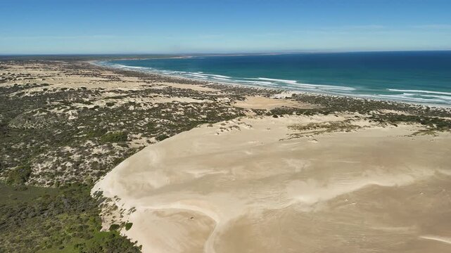 White Hut, Yorke Peninsula, South Australia &ndash; 4K aerial drone view of coastal dunes, native bushland and Daly Head Road Beach