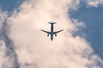 Airplane before landing in blue sky, Airbus A321 © Dmitrii Potashkin