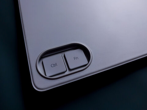 Macro shot showing the Ctrl and Fn function keys on a modern white keyboard case, emphasizing premium build quality, modern design, and functional hardware.