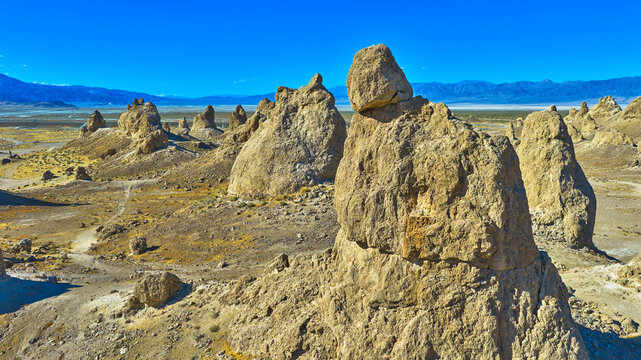 Aerial Trona Pinnacles Tufa Spires and Mojave Desert Landscape under Blue Sky