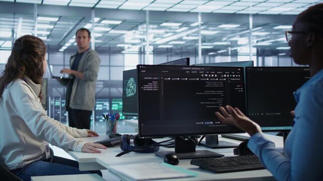 Angry woman gets a computer crash while trying to fix error in data center from a secondary camera angle as capturing conflict, troubleshooting pressure and data center error recovery.
