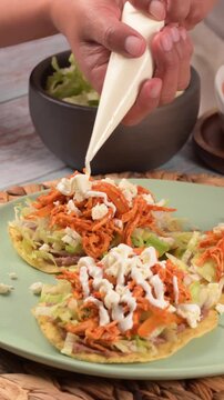Adding sour cream to traditional Mexican chicken tostadas
