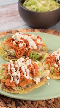 Close up of a plate with Mexican chicken tinga tostadas