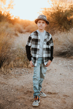 Fall Portrait of Young Boy in Hat and Flannel Shirt
