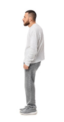 Side profile of young man standing in casual clothes © Pixel-Shot