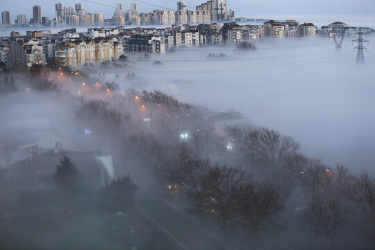 City buildings at foggy sunrise in Istanbul, Turkey.