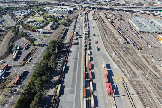 Aerial view cargo trains shipping containers railway yard