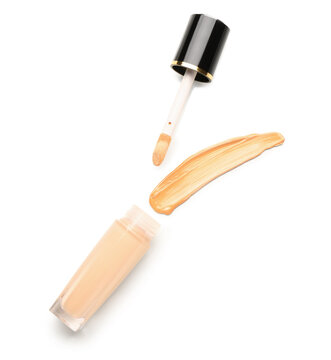 Bottle of makeup foundation and sample isolated on white background