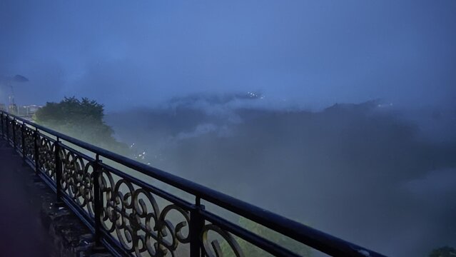 Foggy Mountain View from Ornate Balcony at Blue Hour