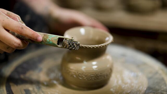 Thai Artisan Sculpting Clay Vase on Spinning Pottery Wheel
