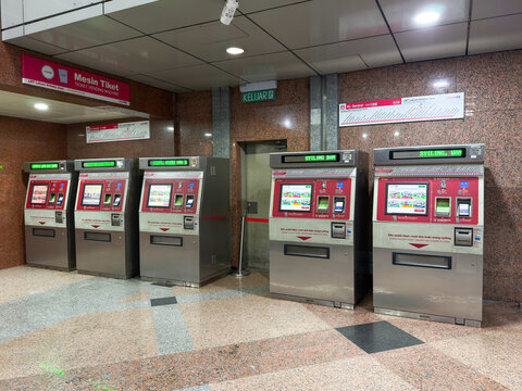 Kuala Lumpur, Malaysia - April 13, 2026: RapidKL Station Ticket Vending Machines with Mesin Tiket Sign and Route Map