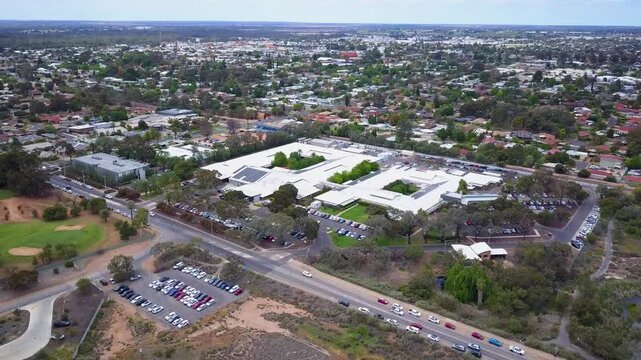 Aerial view of Mildura Base Public Hospital in Victoria, Australia, showcasing the regional medical campus and surrounding car parks - DLOG Flat File 4K
