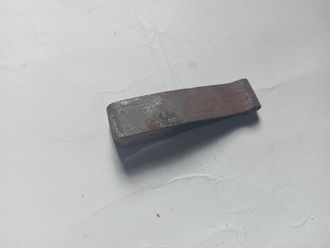 Close-up of dirty and rusty metal tweezers.