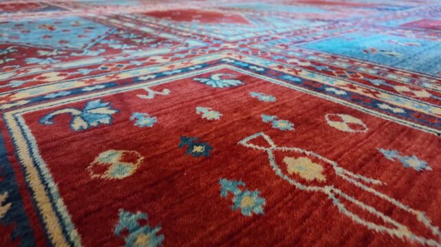 Bright colors on a patterned rug in a mosque