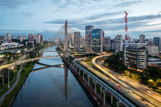 Octavio Frias de Oliveira bridge at blue hour reflected in the river, Sao Paulo, Brazil