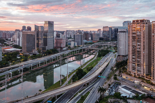 City skyline and Pinheiros River at dusk, Sao Paulo, Brazil
