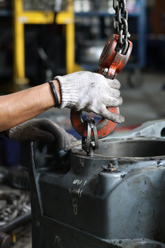Heavy Machinery Lifting Hook and Chain Rigging.