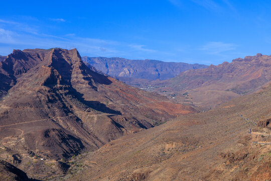 Panorama with mountains and canyon Fataga ravine (Barranco de Fataga) seen from viewpoint Mirador Degollada de las Yeguas on Canary Island Gran Canaria, Spain