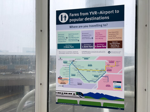 View of sign on a SkyTrain Station Fares from YVR-Airport to popular destination