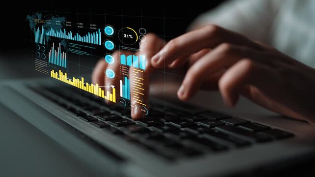 Hands Typing on Laptop with Interactive Data Visualization and Graphs Displayed in Background for Technology and Business Analysis. Entropy.